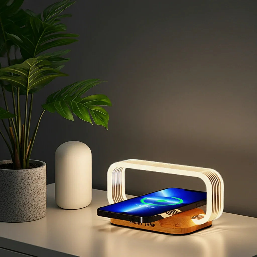 Modern wireless charging smart lamp on nightstand with smartphone, houseplant, and minimal decor
