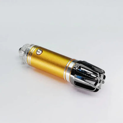 Gold and black electric nose hair trimmer on white background